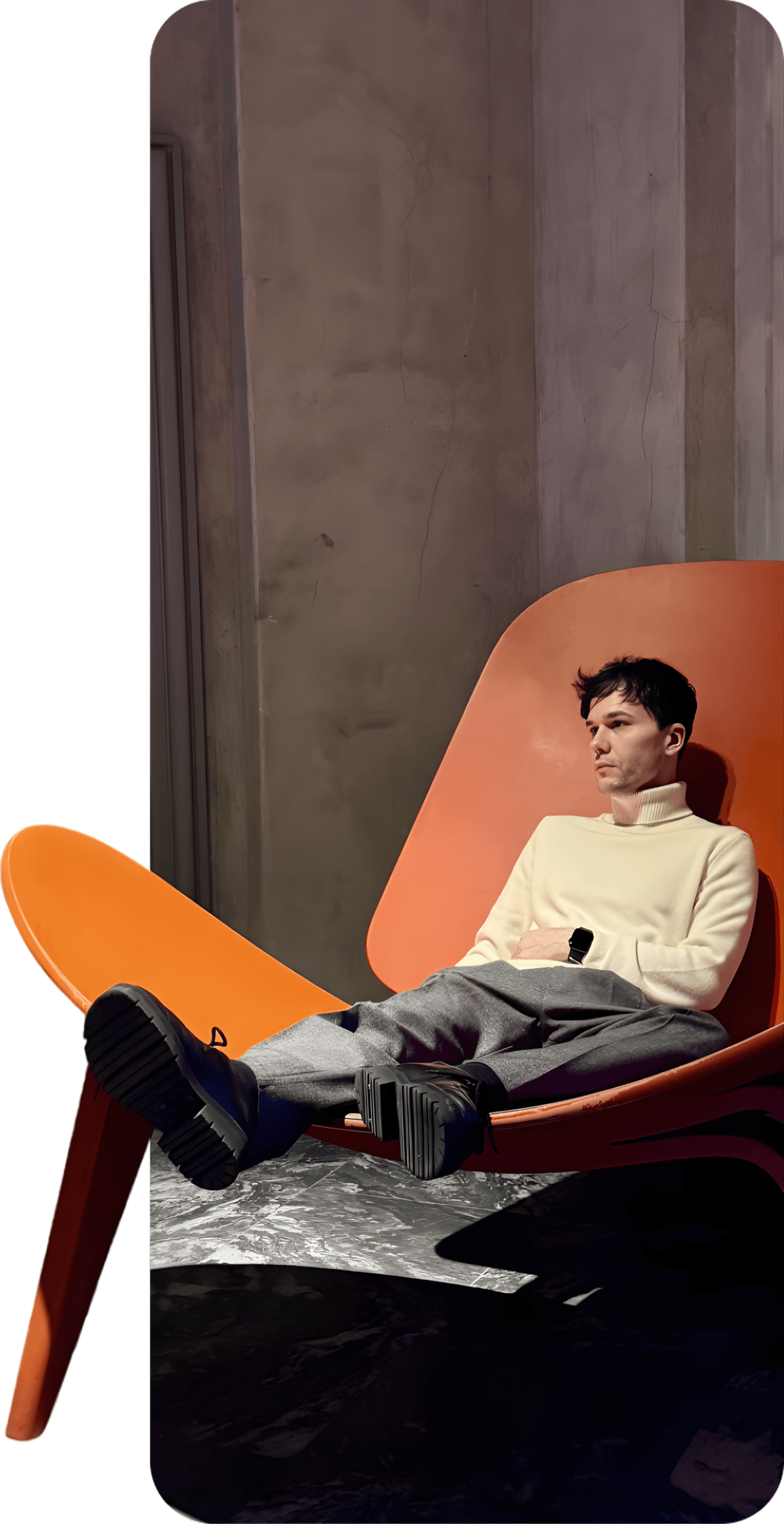 Gregory in an orange chair